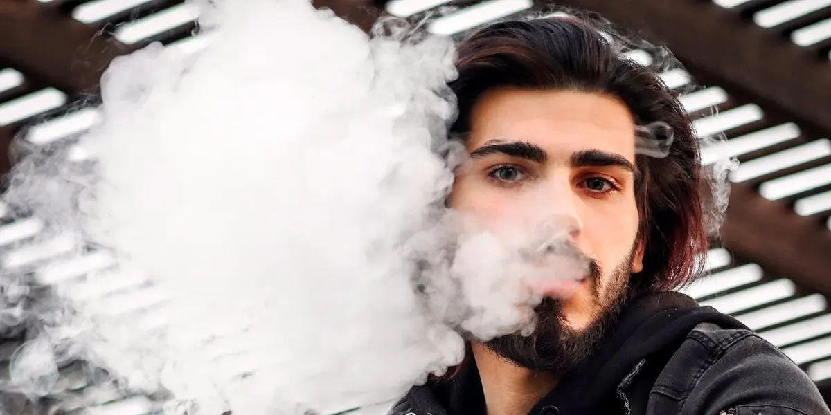 man use rechargeable disposable vapes for vaping