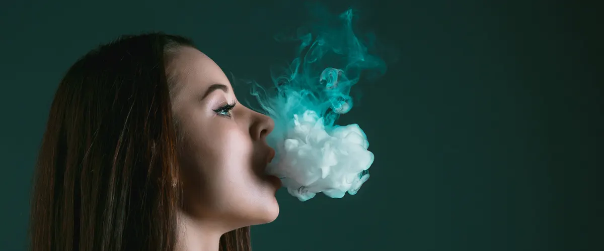 woman enjoy her vaping experience after unclog the disposable vape