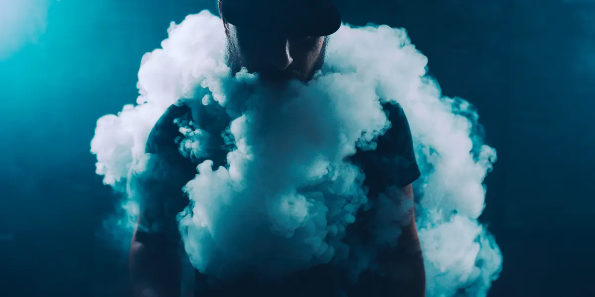 man vaping large puff after unclog his favorate disposable vape