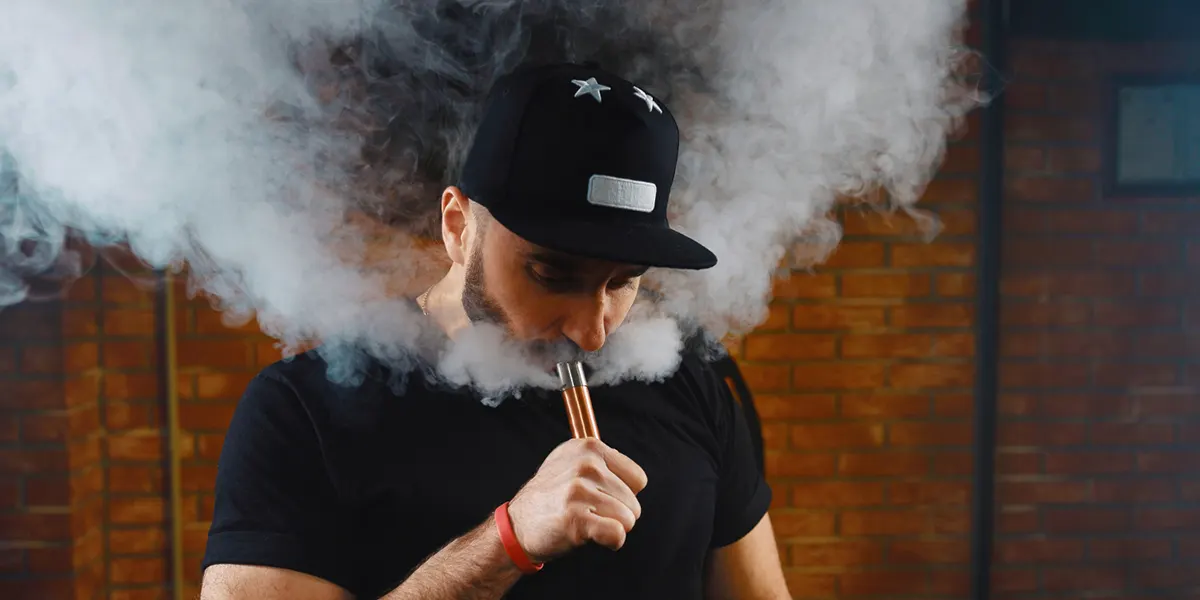 man vaping electronic cigarette with a properly functioning vape coil