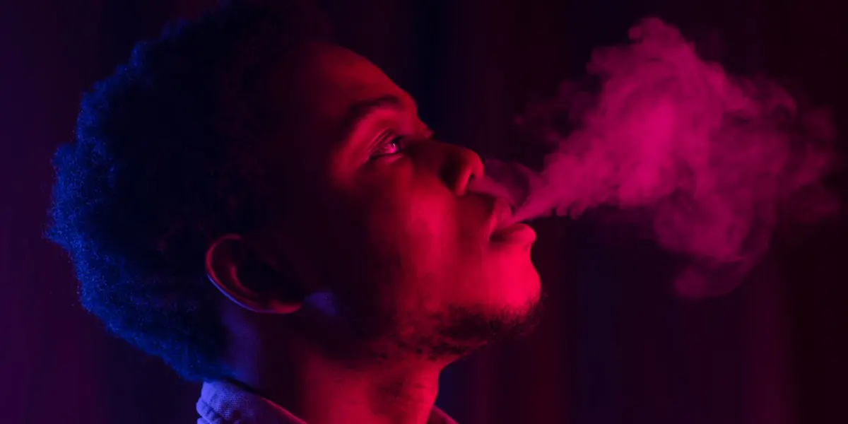 a man vaping after troubleshooting disposable vape common issues
